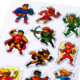 Colorful stickers featuring various superhero characters, including a hero with a shield, an archer, and a flying figure.