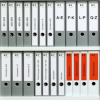 Many organized and labeled folders on the shelf.