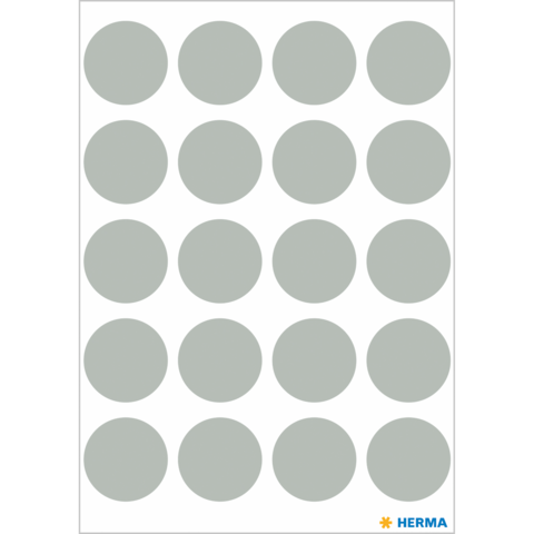 Ein Blatt mit grauen, runden Aufklebern in einem gleichmäßigen Raster angeordnet.