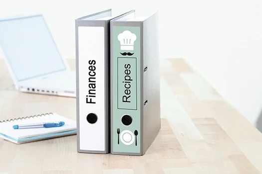 Binder with labels stuck on the desk