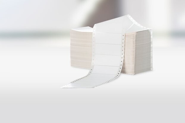 Blank labels: Stack of HERMA folded labels, also known as computer labels or perforated edge labels, landscape format.