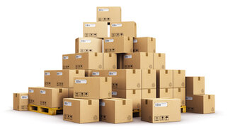A stack of boxes on a pallet, arranged in various heights and sizes. The boxes are labeled.