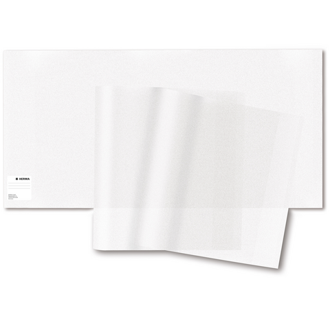Transparente Folienblätter liegen auf einem weißen Hintergrund, teilweise übereinander gestapelt.