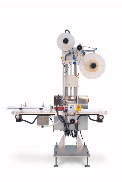 A labeling machine with two rollers, a conveyor belt, and various controls for applying labels to products.