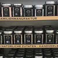 Order roll labels online in digital printing: Spice jars with spice labels on the shelf.