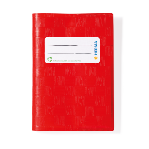 Rotes Notizbuch mit strukturiertem Cover und einem weißen Etikett zum Beschriften.