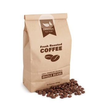 Brown paper bag filled with fresh, roasted coffee, labeled '100% Premium Arabica Whole Beans' and surrounded by coffee beans.