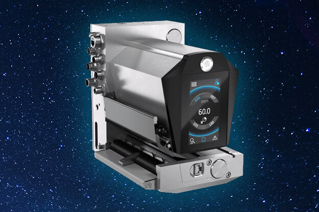 A modern device with a black display and silver surface, set against a starry background.