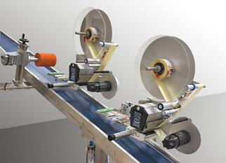 Two labeling machines on a conveyor belt applying labels to products.