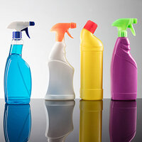 Row of cleaning product bottles in various colors: blue, orange, yellow, and purple, on a reflective surface.