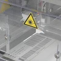Laser-activatable labels with barcode in the production process, close-up of the CO2 laser printing unit.