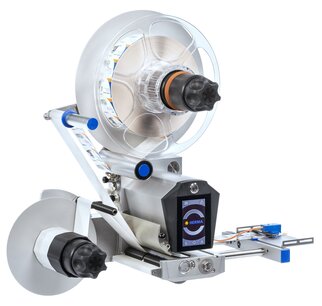Labeling machine with a large roll, a control display, and precise mechanics for applying labels to products.