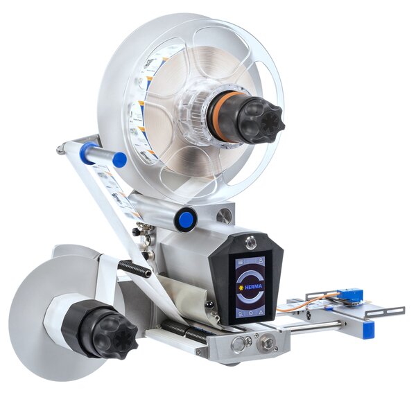 Labeling machine with a large roll, a control display, and precise mechanics for applying labels to products.